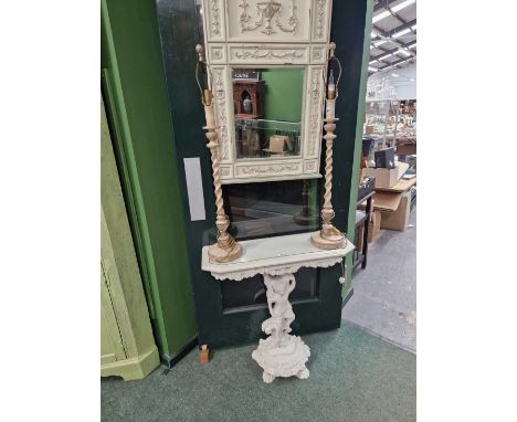 A console table with cherub support and mirror over.