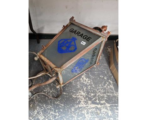 A vintage street lantern with RAC garage glazing.
