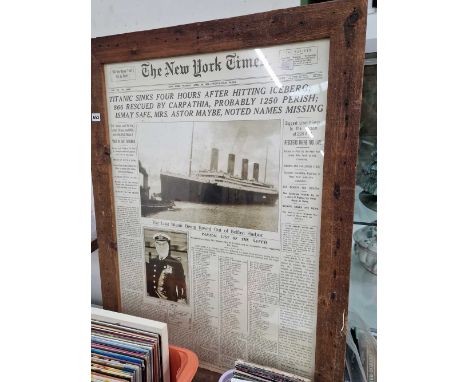 A framed Titanic poster. 