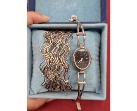 A Catherine Bishop multi wave hallmarked silver cuff bangle and a Dugena wristwatch.
