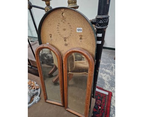 A bagatelle board and two mirrors.