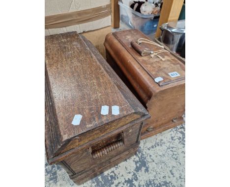 Two vintage sewing machines in wooden cases
