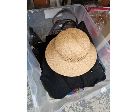 A box of vintage clothing and handbags