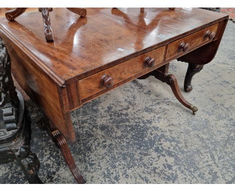 A Regency mahogany and rosewood sofa table. 