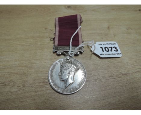 A George VI Army Long Service And Good Conduct Medal with fixed suspender and ribbon with Regular Army clasp named to 1870052
