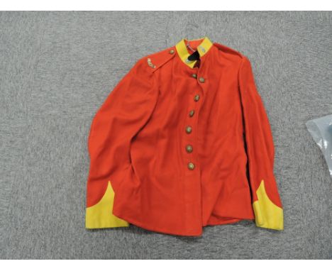 A 1913 Border Regiment Tunic with 9 buttons, 2 Border Tittles and 2 badges, with original label inside Royal Army Supplies