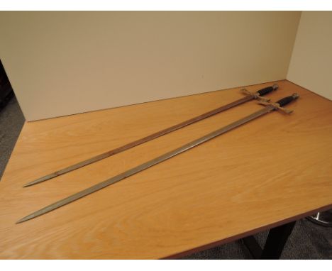 A pair of Wilkinson Sword Masonic Ceremonial Swords, blades marked By Appointment To Her Majesty Queen Elizabeth II Sword Cut