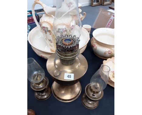A large brass Oil lamp and two smaller