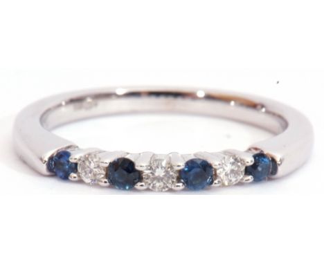 Modern sapphire and diamond ring, alternate set with four round cut sapphires and three round brilliant cut diamonds, stamped