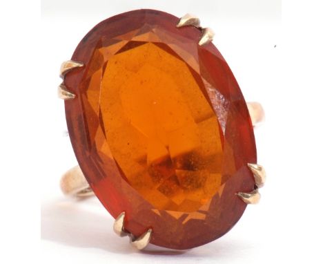 Vintage cognac coloured citrine dress ring, an oval faceted citrine, double claw set in a basket mount, 20 x 15mm, to a plain