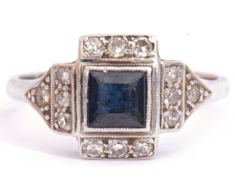 Art Deco sapphire and diamond ring, centring a square cut sapphire framed by a small diamond set surround, stamped 18ct and P