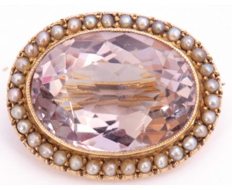 Antique pale amethyst and seed pearl brooch, the oval shaped faceted pale amethyst, 23 x 15mm, framed in a millegrain edge su