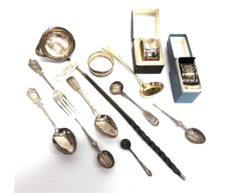 A SMALL COLLECTION OF SILVER FLATWARE including a coin set toddy ladle; and three silver napkin rings; 154g (4.9 troy ozs) gr