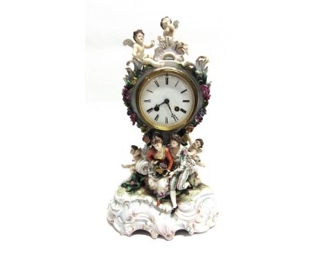 A LARGE CONTINENTAL CERAMIC MANTLE CLOCK  the 8-day chiming movement stamped 'MIROY FRERES A PARIS', the porcelain body with 