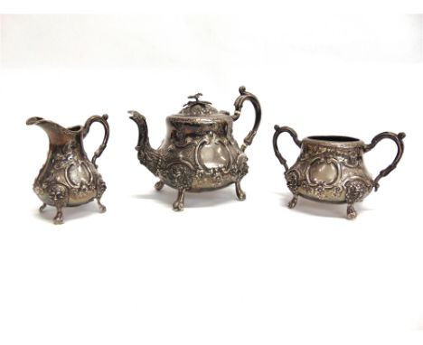 A VICTORIAN SILVER THREE PIECE BACHELOR TEA SERVICE by Robert Harper, London 1866, of baluster form, embossed with foliage an