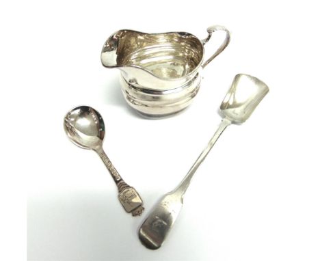 A SILVER CREAM JUG London 1899, of helmet shape; with an Irish William IV silver shovel bowl spoon, Dublin 1830; 111g (3.58 t