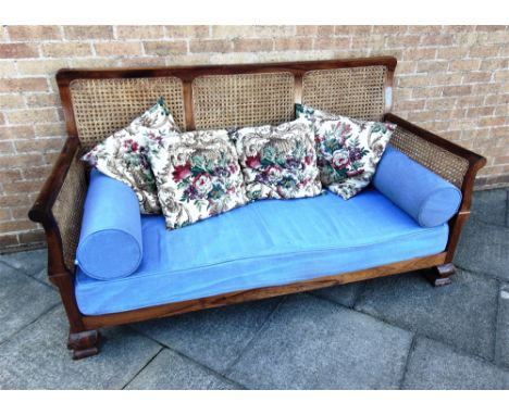 A ROSEWOOD FRAMED BERGERE SOFA  on foliate carved ogee bracket feet, 188cm wide 82cm deep 102cm high