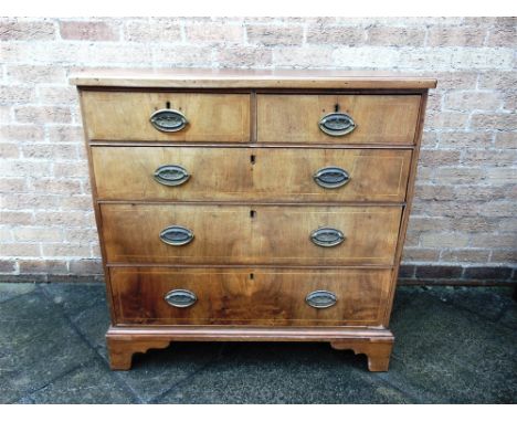 A GEORGE III OAK AND WALNUT CHEST OF TWO SHORT AND THREE LONG DRAWERS  with line inlaid decoration, on bracket feet, 94cm wid