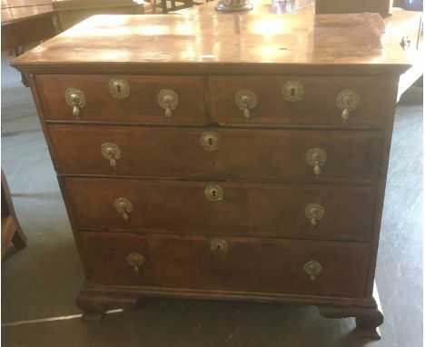 AN EARLY 18TH CENTURY WALNUT CHEST OF TWO SHORT AND TWO LONG DRAWERS  with featherbanded inlay, on ogee bracket feet, 101cm w