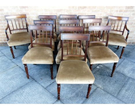 A SET OF TWELVE GEORGE IV MAHOGANY DINING CHAIRS  including a pair of carvers, with tablet centred top rail supported by reed