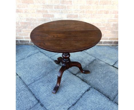 AN OAK TILT TOP TRIPOD OCCASIONAL TABLE  the circular top 78cm diameter 70cm high