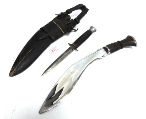 A NEPALESE KUKRI  the 28cm typically curved blade with a carved wood grip, in a leather scabbard, overall 40.5cm long; togeth