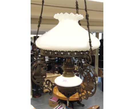 A DUTCH HANGING OIL LAMP  with opaque white glass shade and reservoir, 29cm diameter, 71cm high overall