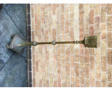 A PAIR OF HEAVY BRASS MOORISH STANDS  on square spreading bases with canted corners, pierced octagonal basket tops, 131cm hig