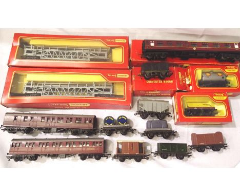 Fourteen Triang Hornby OO rolling stock comprising R342 car transporter x2, convertor wagon, flat wagon and car, tanker, all 