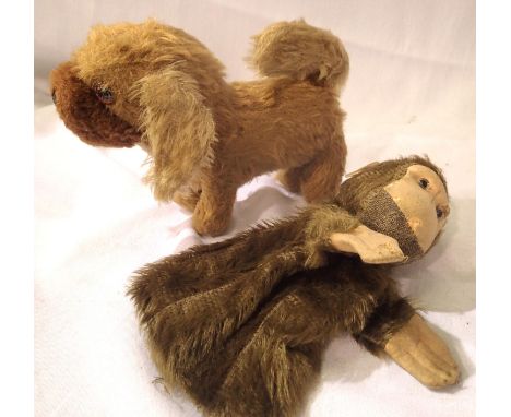 Vintage straw filled toy dog, H: 20 cm and a vintage monkey glove puppet, H: 20 cm, both good condition. P&amp;P Group 1 (£14