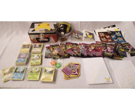 Large collection of Pokemon items to include trading cards (including some shiny/holographic examples), notebooks, sticker an