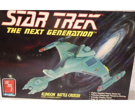AMT plastic kit Klingon Battle Cruiser, approximately thirteen inches long, appears complete, unstarted, contents unchecked. 