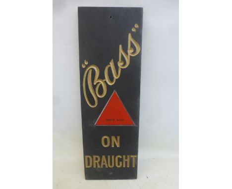 A 'Bass on Draught' rectangular slate pub sign, with triangular red enamel trademark panel, 10 x 30".