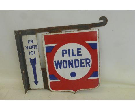 A French double sided enamel sign with integral bracket advertising Pile Wonder, 21 3/4 x 19".