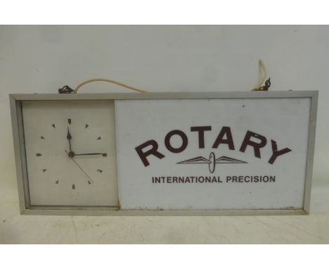 A Rotary 'International Precision' rectangular advertising showroom clock, 25"w x 10 1/2"h x 4"d.