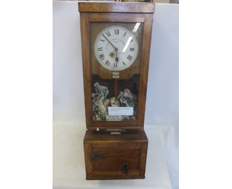 A Gledhill-Brooke Time Recorders oak clocking-in clock, by repute used at Holmans Camborne.