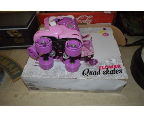 A pair of girls roller skates 