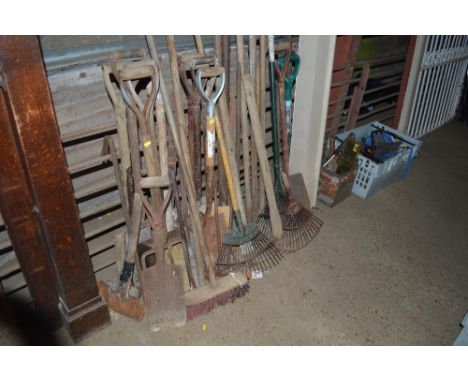 A large quantity of long handled gardening tools 
