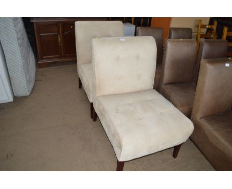 A pair of suede upholstered button down chairs