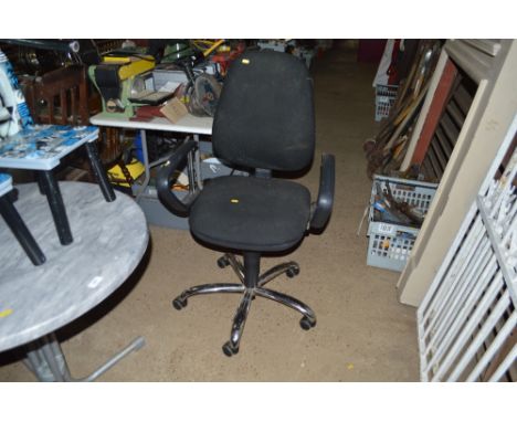 A black upholstered swivel office chair 