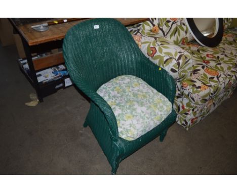 A green painted loom arm chair 