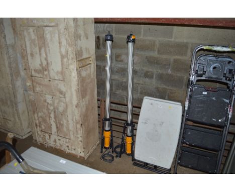 A pair of halogen tripod lights, one AF