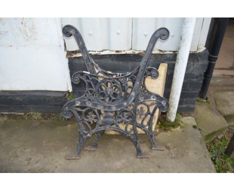 A pair of ornate garden bench ends 