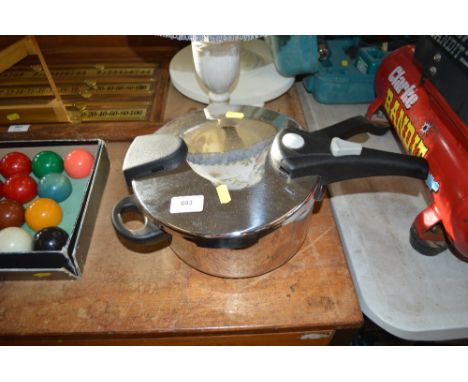 A John Lewis pressure cooker with instruction manual