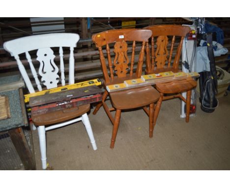 A pair of pine dining chairs and one painted pine dining chair