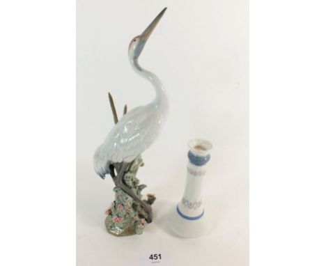 A Lladro crane, 29cm high and a similar candlestick 