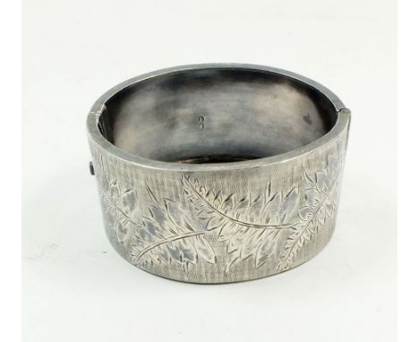 A Victorian silver bangle engraved ferns, Birmingham 1884 approx 6cm diameter 