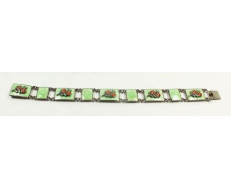 A silver plated and enamel green and floral bracelet by K &amp; F 