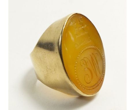 An antique 9 carat gold agate set signet ring, engraved lion and monogram, size M/N, 10.6g, the stone approx 2.5cm length, 2c