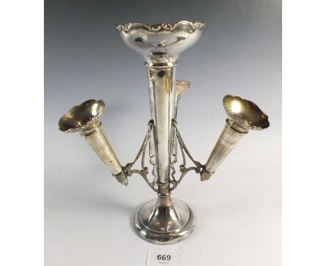 An antique silver epergne with central vase and three removable tapered vases on a circular weighted base, Birmingham 1912, m